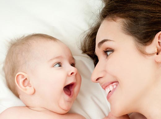 Mother and baby laughing